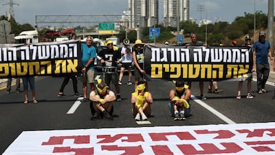 Protesters block a road at Petah Tikva, Israel on Tuesday, part of a day of action by the families of Israeli hostages calling for an end to the Gaza war. EPA