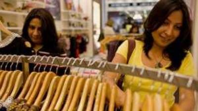 Swati Gandhi, left, from the US, and Suparna Jha, from Bangalore, shop at the Dubai Mall.