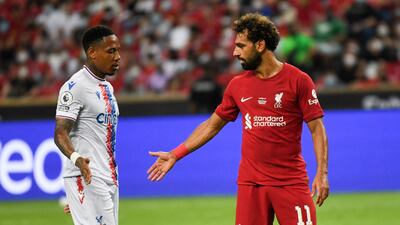 Liverpool's forward Mohamed Salah greets Crystal Palace's defender Tyrick Mitchell during their friendly match at the National Stadium in Singapore. AFP