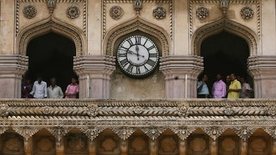 Tourists stand at the historical monument Charminar in the southern Indian city of Hyderabad. Krishnendu Halder/Reuters