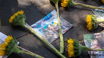View of flowers and banners calling for 'peace in Ukraine' put up by Amnesty International activists in front of the Russian Embassy in Mexico City in March. EPA