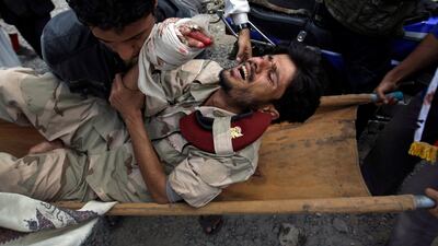 Anti-government protesters carry a wounded defected soldier from the site of clashes with security forces to a field hospital in Sanaa, Yemen, Monday, Sept. 19, 2011. Hani Mohammed / AP Photo