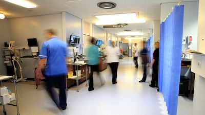 Staff on an NHS hospital ward. Junior doctors in England will strike in March. PA