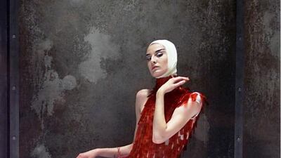 A McQueen creation made with dyed ostrich feathers, as presented at London Fashion Week in 2001. Photo by REX