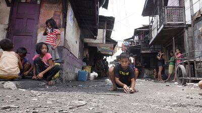 Some of the children who reside in the Smokey Mountain Reclamation Area located in North Manila, suffer from malutrition and live in substandard living conditions. Mike Young for the National
