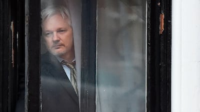 Room with a view: WikiLeaks founder Julian Assange emerges onto the balcony of the Ecuadorian embassy on February 5, 2016 to address the media in central London. Ben Stansali / AFP
