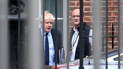 Britain's Prime Minister Boris Johnson (L) and his then special advisor Dominic Cummings leave from the rear of Downing Street in central London, before heading to the Houses of Parliament, September 03, 2019. AFP