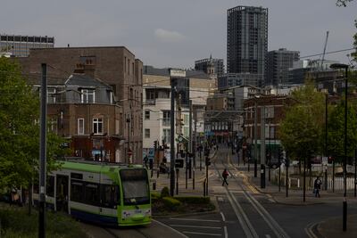 A tram makes its way through Croydon in South London. Photo: Getty