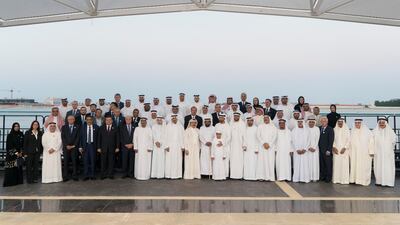 Sheikh Mohammed bin Zayed, Crown Prince of Abu Dhabi and Deputy Supreme Commander of the UAE Armed Forces (front row 13th left), stands for a photograph with members of "Brainstorm Alliance" initiative, co-ordinated by The Emirates Center for Strategic Studies and Research (ECSSR), during a Sea Palace barza. Courtesy Crown Prince Court - Abu Dhabi