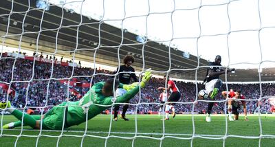 Manchester United's Romelu Lukaku, right, scores against Southampton. Dylan Martinez / Reuters