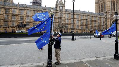 EU flags outside the Houses of Parliament in London. Upcoming elections may take spotlight off negative aspects of UK-EU divorce. Peter Nicholls/Reuters