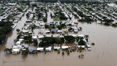 Houses seen surrounded by flood waters in the town of Ingham, located in North Queensland, Australia. Dan Peled / Reuters