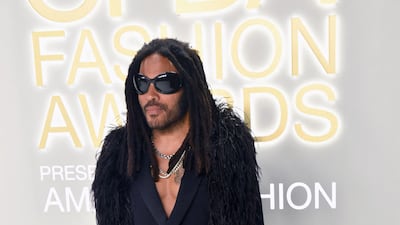 Lenny Kravitz was named Fashion Icon at the event. He wore a custom look of leather trousers and a feather boa.