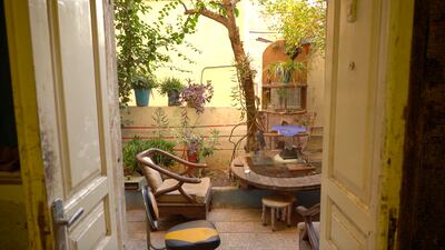 The garden of Mafadleh’s ground-floor flat is full of his works, and street cats. Amy McConaghy / The National