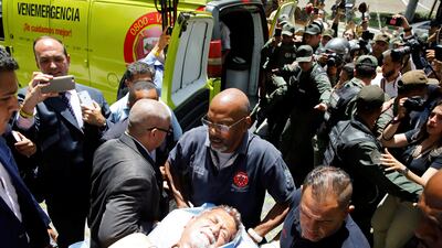 Opposition politician Americo De Grazia is taken away on a stretcher after he was injured when a group of government supporters burst into Venezuela's opposition-controlled congress in Caracas, Venezuela on July 5, 2017. Carlos Garcia Rawlins / Reuters