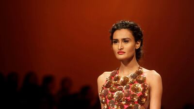 August 18, 2011: An Indian model displays designer Nachiket Barve creations during the Lakme Fashion Week in Mumbai. AP Photo/Rajanish Kakade