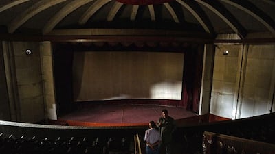 Mohammad Karim Aryobwal, 60, owner of the abandoned Aryob Cinema, gives a tour of the property.
