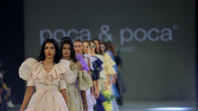 Models present creations by the Polish brand Poca and Poca during this week's Arab Fashion Week, womenswear spring/summer 2022, runway shows in the Dubai Design District. AFP