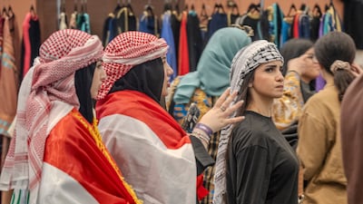 People dressed in traditional Iraqi clothing attend the gathering