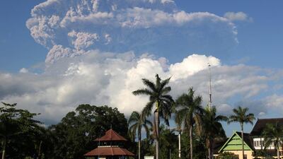 Agiant cloud of ash and steam rise from erupting Sangeang Api volcano seen from Bima town on Sumbawa island. Flights into and out of the northern Australian city of Darwin were cancelled, and some to Bali affected, after huge ash clouds were thrown up by an Indonesian volcano. Andy Amalda / AFP