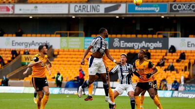 West Brom's Semi Ajayi makes it 2-2 at Molineux. AFP