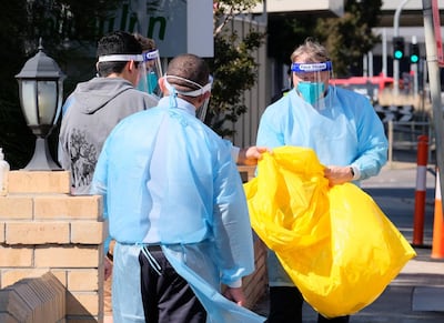 Medical staff at the Holiday Inn hotel in Melbourne after a Covid-19 outbreak. EPA