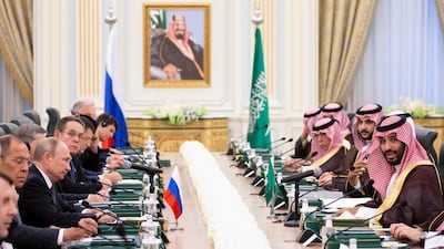 Prince Mohammed bin Salman speaks to Mr Putin during the talks. AP Photo