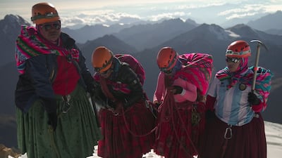 From left, Adela Llusco, Senobia Llusco, Cecilia Llusco and Camila Tarqui Llusco, Aymara indigenous women members of the Climbing Cholitas at the summit of Huayna Potosi. AFP