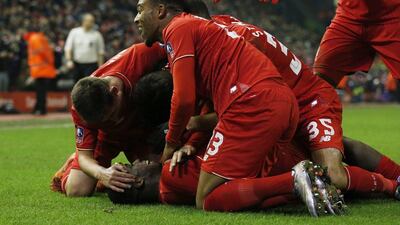 Liverpool players congratulate Sheyi Ojo after his goal in the FA Cup against Exeter on Wednesday night. Phil Noble / Reuters / January 20, 2016