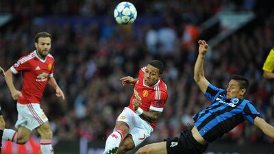 Manchester United's Memphis Depay, centre, in action during their Uefa Champions League play-off first leg match against Club Brugge at Old Trafford in Manchester, Britain, 18 August 2015. EPA/PETER POWELL