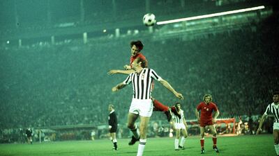 Ajax's Johan Cruyff jumps above Juventus defender Francesco Morini, front, during the 1973 European Cup final in Belgrade. Colorsport/Rex/Shutterstock