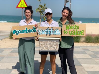 Marta Roman, centre, runs the Save the Butts campaign for Goumbook, which has volunteers clearing up cigarette butts across the UAE. Photo: Marta Roman