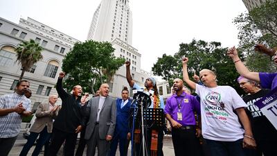 Faith, labour, immigrant and community leaders rally outside Los Angeles City Hall to denounce racism and demand change. AFP