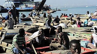 Thousands of Haitians wait at the port as they attempt to leave Port-au-Prince 12 days after the earthquake.