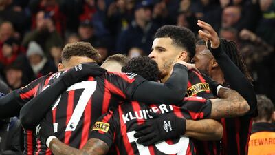 Bournemouth players celebrate Dominic Solanke's opening goal. Reuters