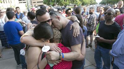Angelica Marrufo, Alejandro Monroy, Andres Vanegas and Alva Velez attended the vigil while visiting Austin from Chicago. Hundreds gathered on the south steps of the Texas State Capitol in Austin, Texas, on Sunday to hold a vigil for the people killed at the nightclub shooting in Orlando, Florida. Ralph Barrera / Austin American-Statesman via AP