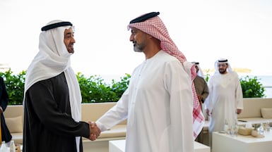 President Sheikh Mohamed, left, greets Sheikh Ammar bin Humaid Al Nuaimi, Crown Prince of Ajman, at Qasr Al Bahr. Photo: UAE Presidential Court