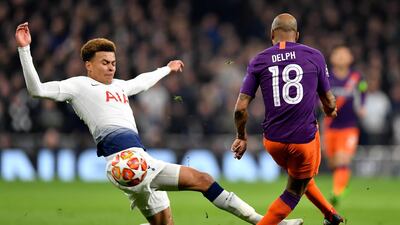 Tottenham's Dele Alli tackles Manchester City's Fabian Delph. Getty Images