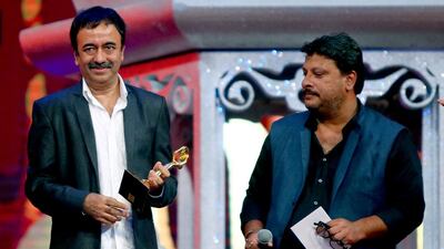 Indian film director Rajkumar Hirani holds his “best film” award for “PK” during the Arab Indo Bollywood Awards ceremony. AFP