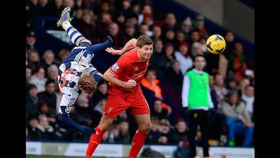 West Bromwich Albion's Matej Vydra takes a tumble after going for a header against Liverpool's Steven Gerrard. Andrew Yates / AFP Photo