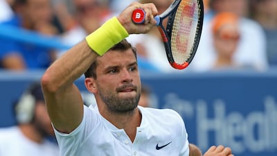 Grigor Dimitrov returns a shot against Nick Kyrgios in the final of the Cincinnati Masters at the Lindner Family Tennis Center. Aaron Doster / USA Today