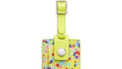 St Jude luggage tag, Dh275, Tumi