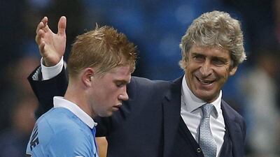 Manchester City's Manuel Pellegrini celebrates with Kevin de Bruyne after their Champions League win over Sevilla on Wednesday. Phil Noble / Reuters / October 21, 2015