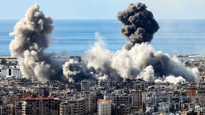 Smoke rises from an Israeli air strike on southern Beirut in 2024. Hezbollah covers the rent of Lebanese whose homes were destroyed in the war. AFP