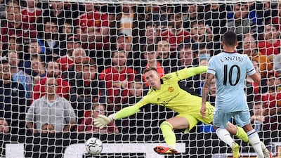 West Ham midfielder Manuel Lanzini scores past Manchester United goalkeeper Dean Henderson in the Carabao Cup match at Old Trafford on Wednesday. AFP