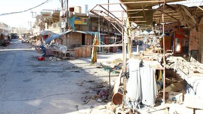 This once-bustling intersection in Jalwala is now desolate, its facade destroyed and its shops emptied. Florian Neuhof for The National