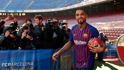 Barcelona's new Ghanaian forward Kevin-Prince Boateng arrives for his official presentation at Camp Nou. AFP