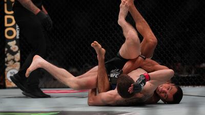 Umar Nurmagomedov, right, fighting Cory Sandhagen in a bantamweight bout at UFC Fight Night in Abu Dhabi on August 3. Photos: AP
