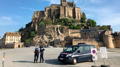 Police at the scene of an evacuation at Mont Saint-Michel, on France's northern coast, after a visitor apparently threatened to attack security services. Denis Surfys / AP