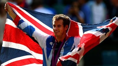 Andy Murray poses with his gold and silver medals at London 2012